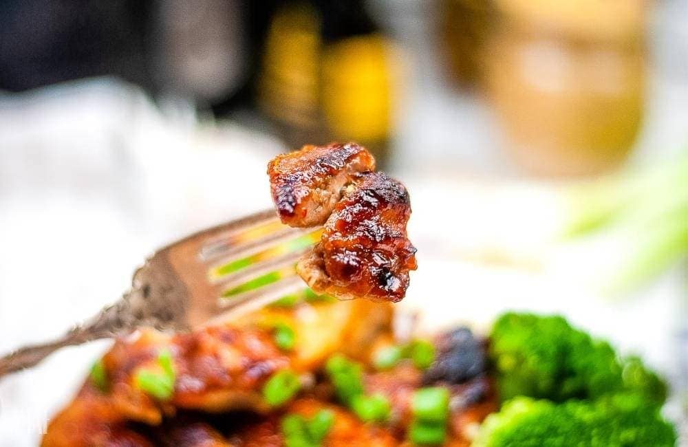 a bite of air fryer Huli Huli chicken on a fork